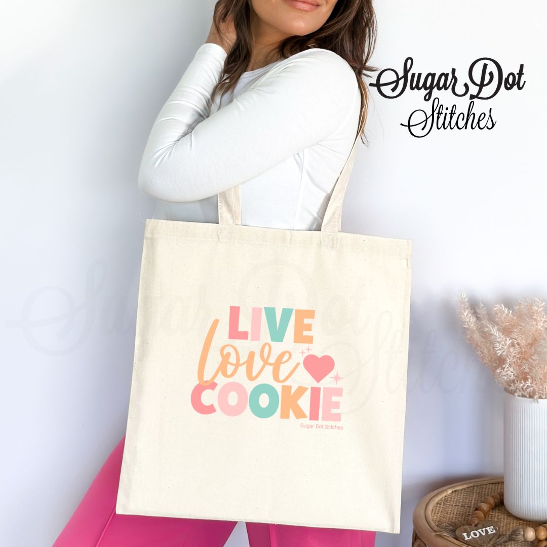 http://www.sugardotcookies.com/uploads/1/1/3/2/11322282/canvas-tote-bag-sugar-live-love-cookier-cookie-decorator-gift-baker-carry-supplies-classes-teach-2_orig.jpg